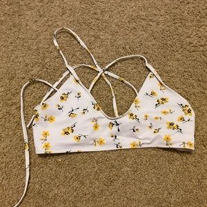 white and yellow flowered bathing suit top